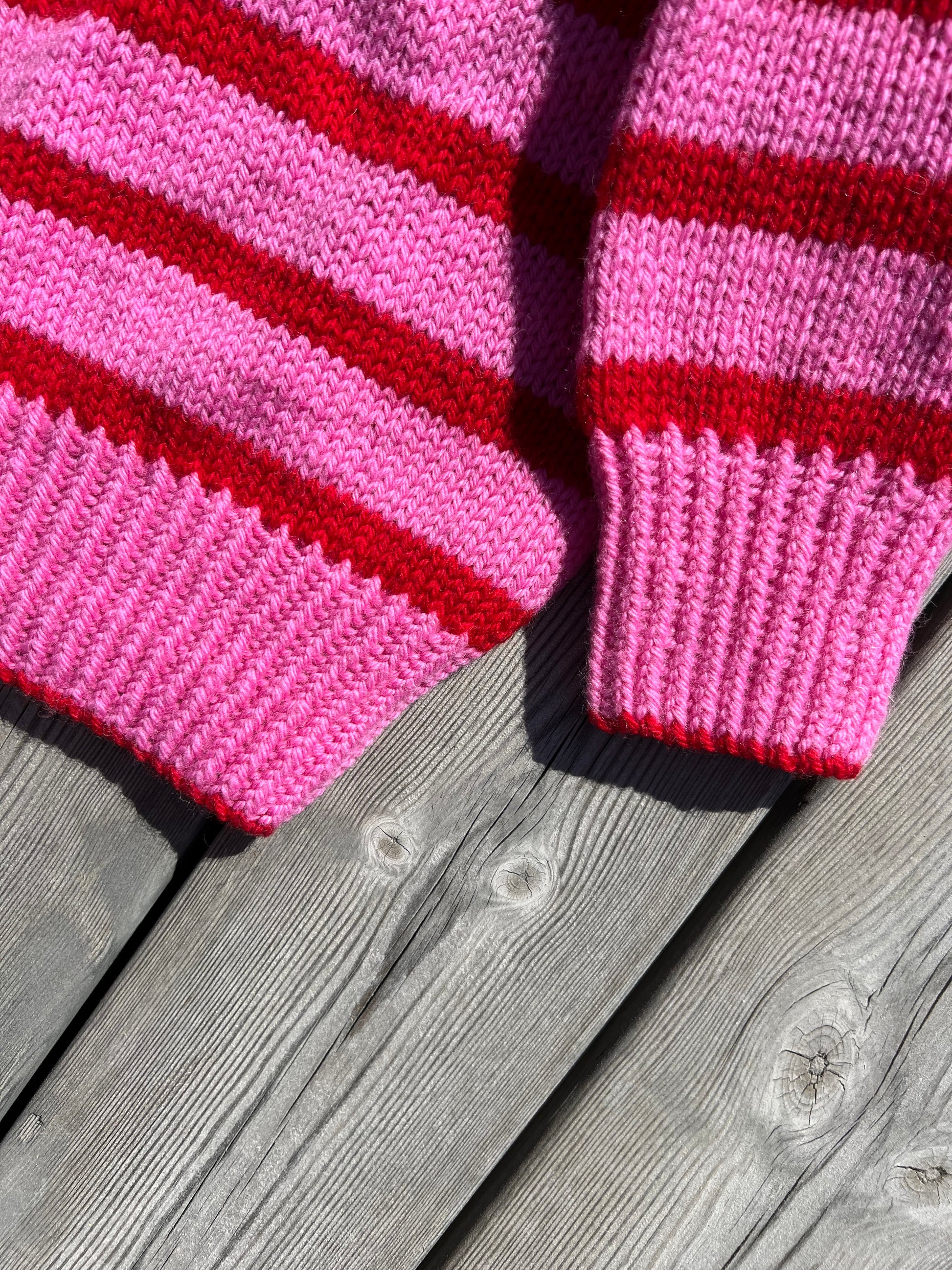 Pink and red striped knitted sweater for kids