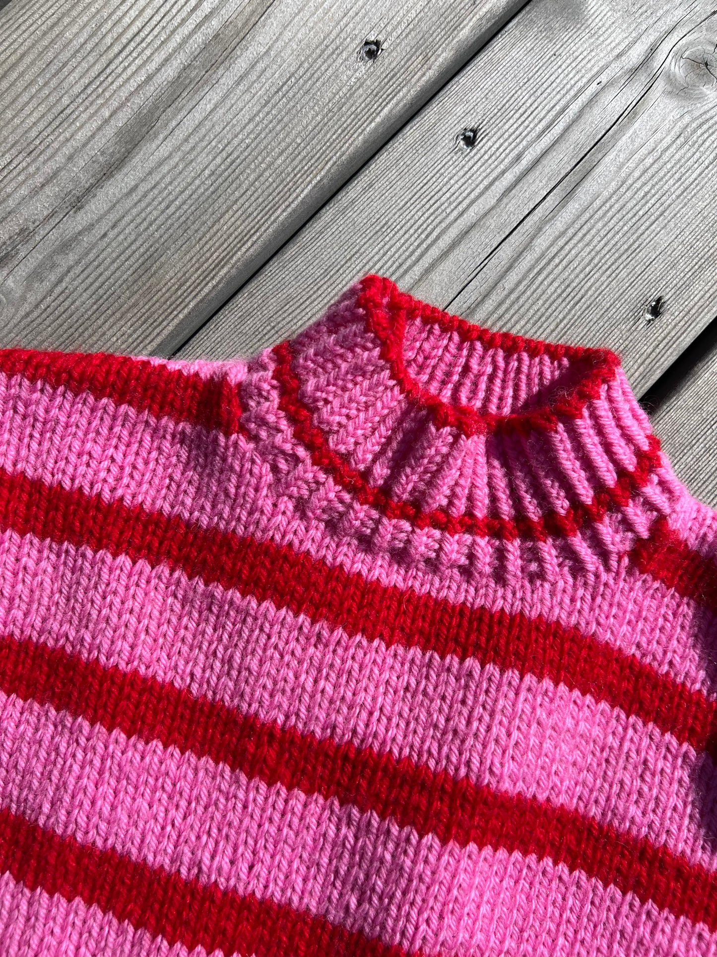 Pink and red striped knitted sweater for kids