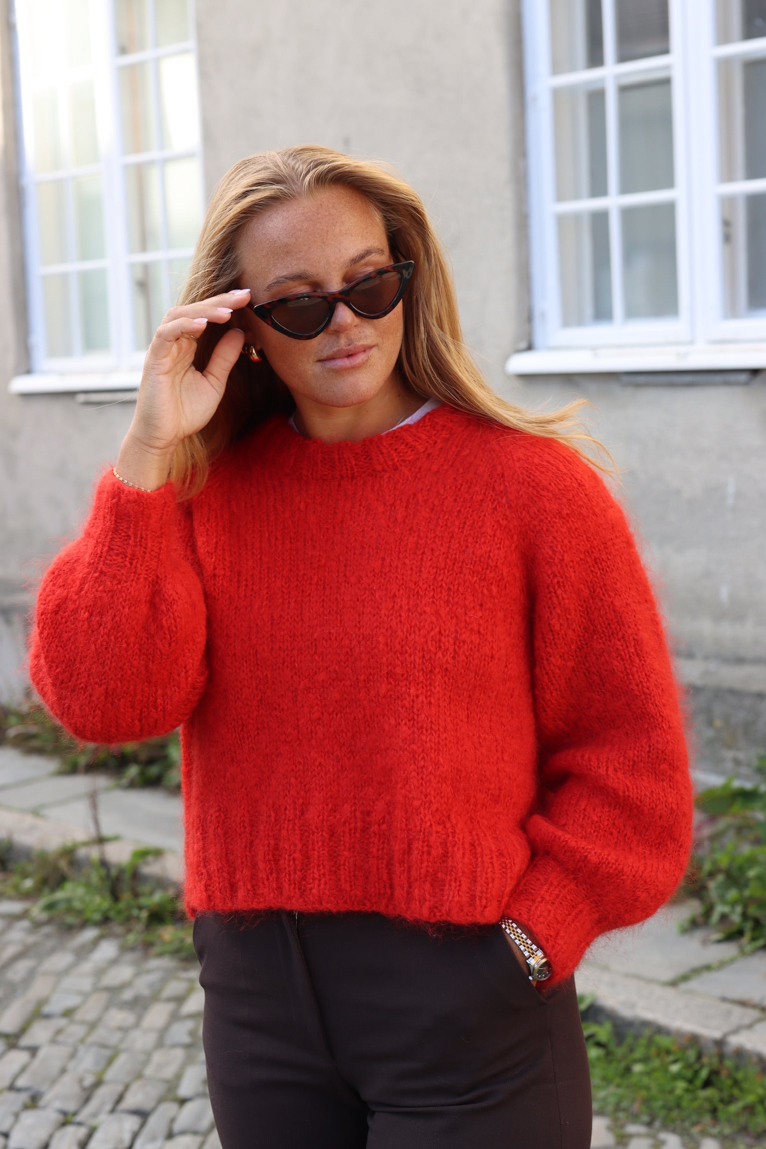 Red raglan sweater with balloon sleeves and 2x2 ribbing from Dreamknit's design tool, made with Un-told Fuzzy Mohair in the color Red Flag