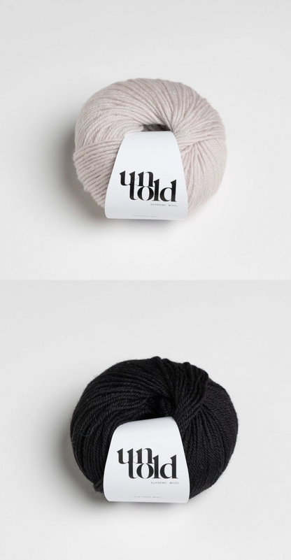 Black and white yarn kit for a striped knitted sweater